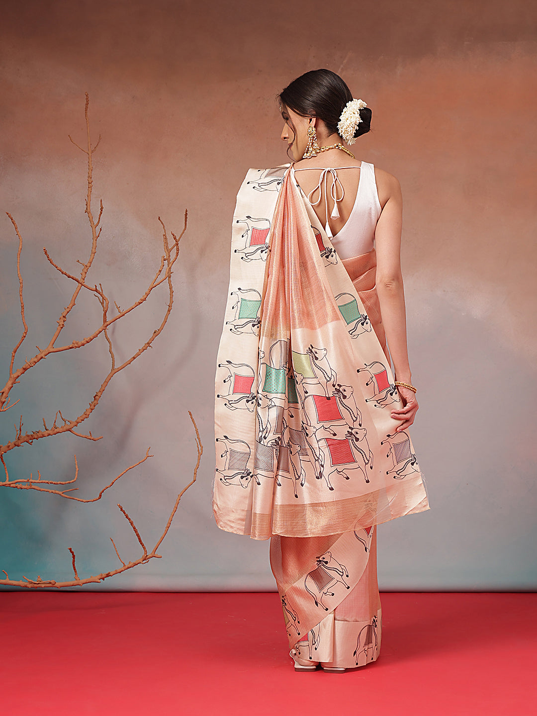 Peach Folk Art Cow Motif Saree with Traditional Printed Pallu